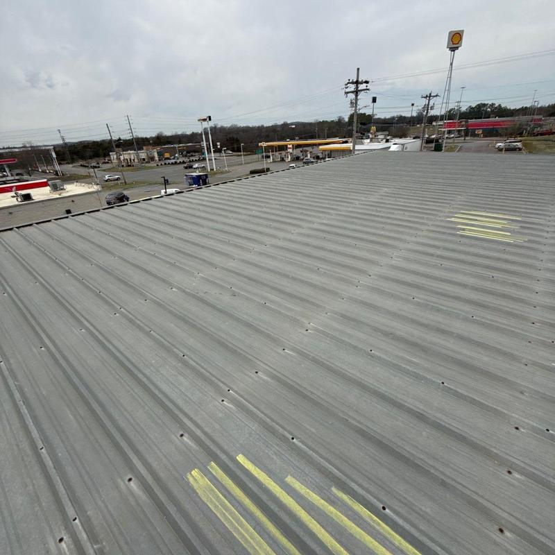 Metal roof panel with hail damage markings