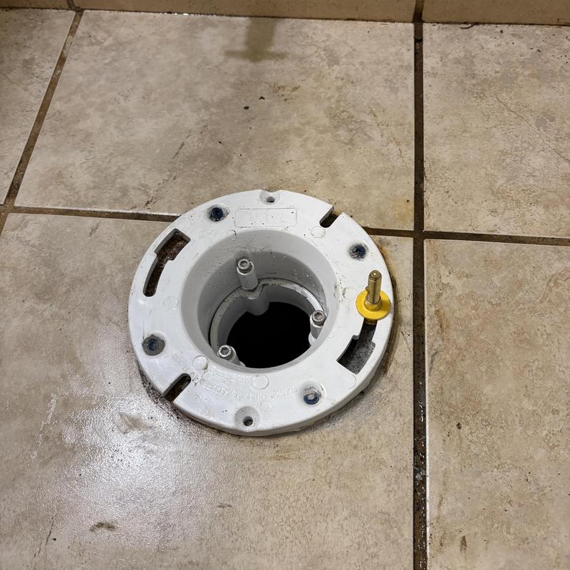 Toilet flange with cast-iron to PVC transition installed Toilet flange with cast-iron to PVC transition installed