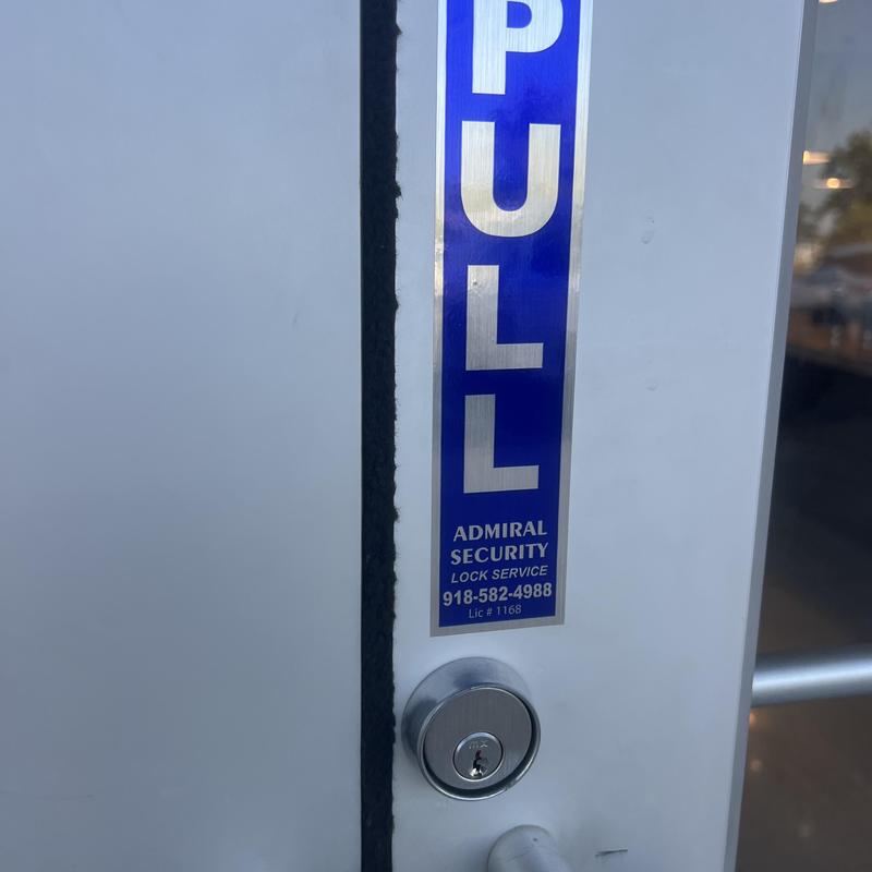 MX key system cylinder lock on door with pull sign MX key system cylinder lock on door with pull sign
