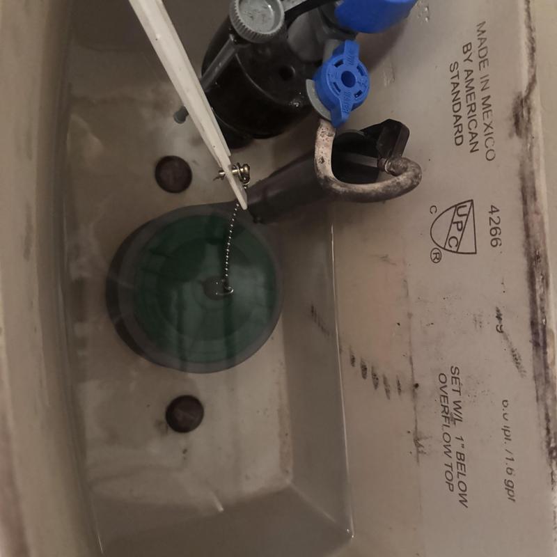 Toilet flush valve inside tank with water level Toilet flush valve inside tank with water level