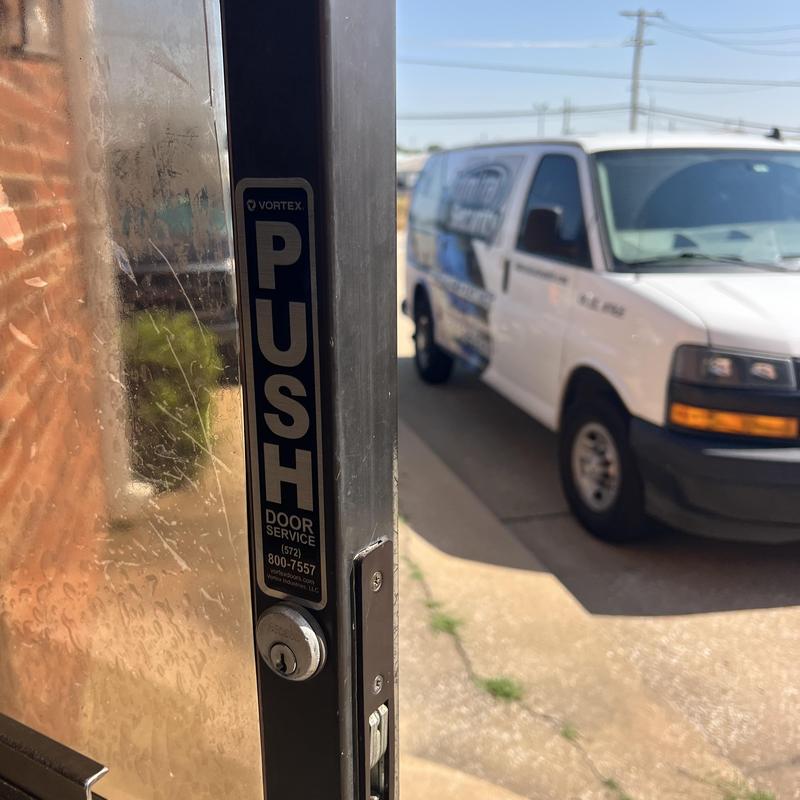 Commercial door lock with rekey service in progress Commercial door lock with rekey service in progress