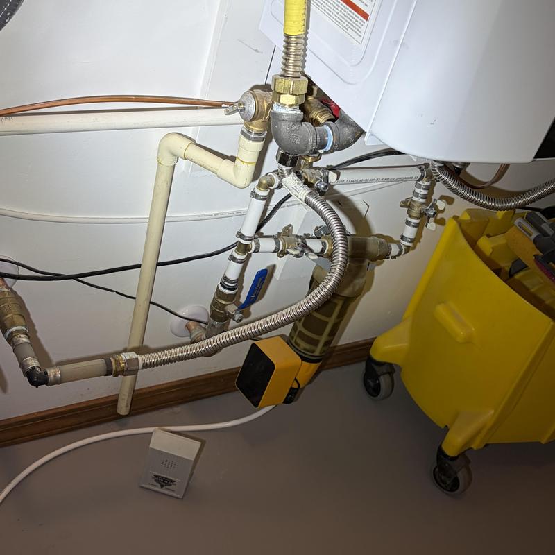 PEX waterline connections under water heater with filter system