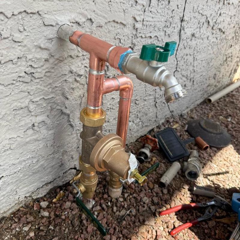 Outdoor water faucet and pressure reducing valve installation