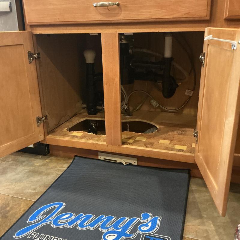 Kitchen sink drain pipes under cabinet with missing countertop Kitchen sink drain pipes under cabinet with missing countertop