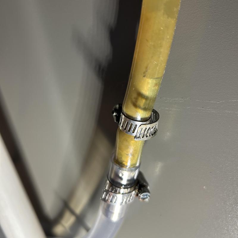 Furnace condensate drain hose with secured clamps Furnace condensate drain hose with secured clamps