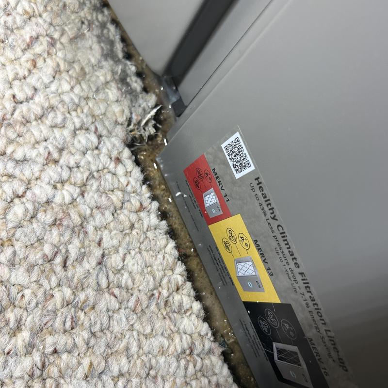 Furnace base leaking water onto carpet edge Furnace base leaking water onto carpet edge