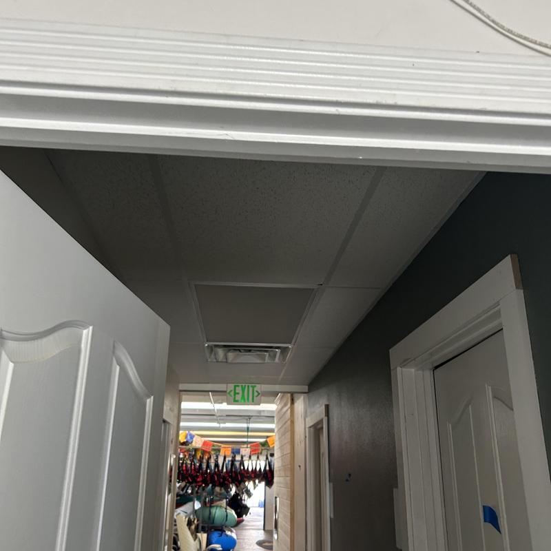 Commercial ceiling light fixture in hallway