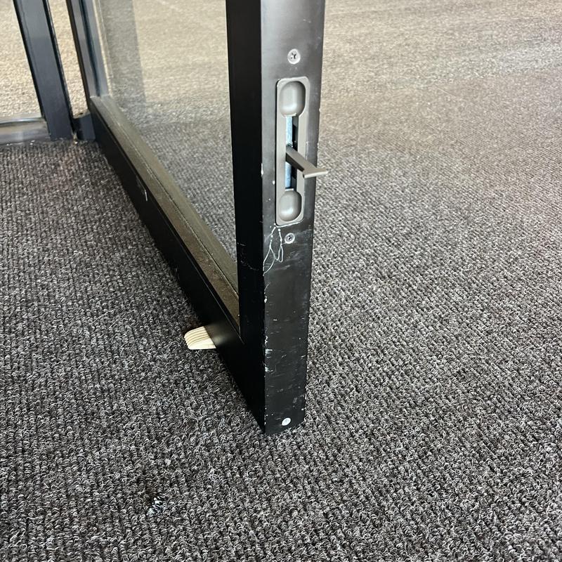 Flush bolt on business interior glass door installation Flush bolt on business interior glass door installation