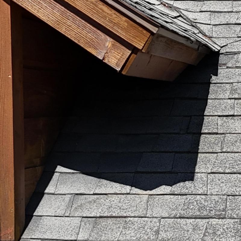Fascia and soffit woodwork near gray shingle roof Fascia and soffit woodwork near gray shingle roof