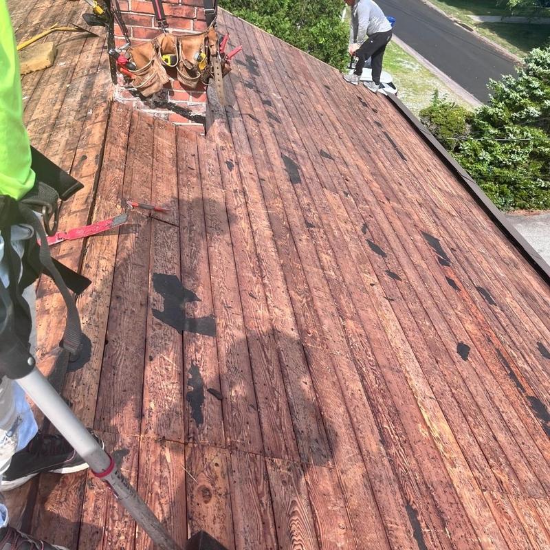 Wood roof decking removal on residential roof Wood roof decking removal on residential roof
