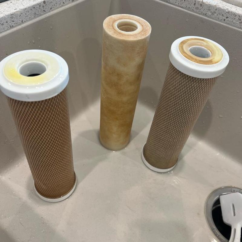 Reverse osmosis filter cartridges removed for replacement Reverse osmosis filter cartridges removed for replacement