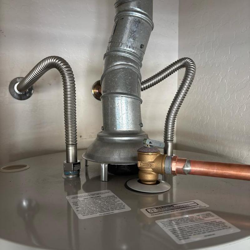 Water heater valve and flex lines installed in garage Water heater valve and flex lines installed in garage
