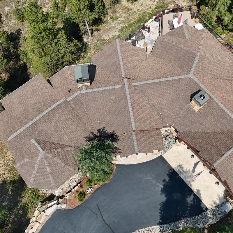 Asphalt shingle roof and gutters inspection from above