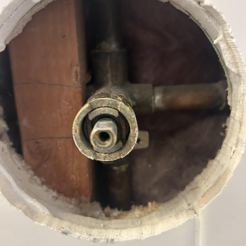 Shower valve assembly inside wall cavity, plumbing repair Shower valve assembly inside wall cavity, plumbing repair