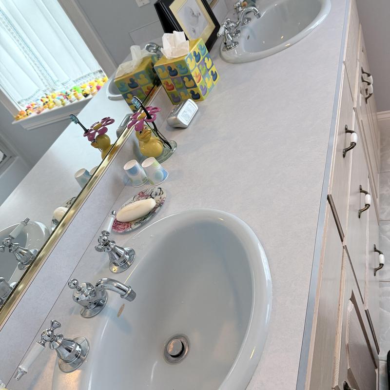Double vanity faucets with chrome handles and sinks