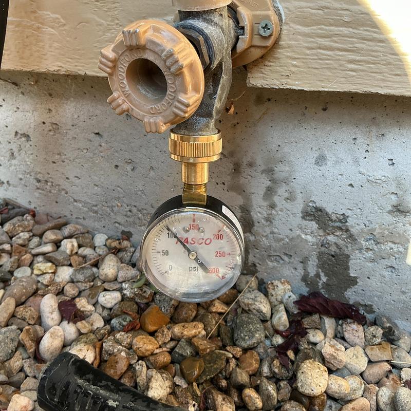 Outdoor water pressure gauge on hose bibb valve Outdoor water pressure gauge on hose bibb valve
