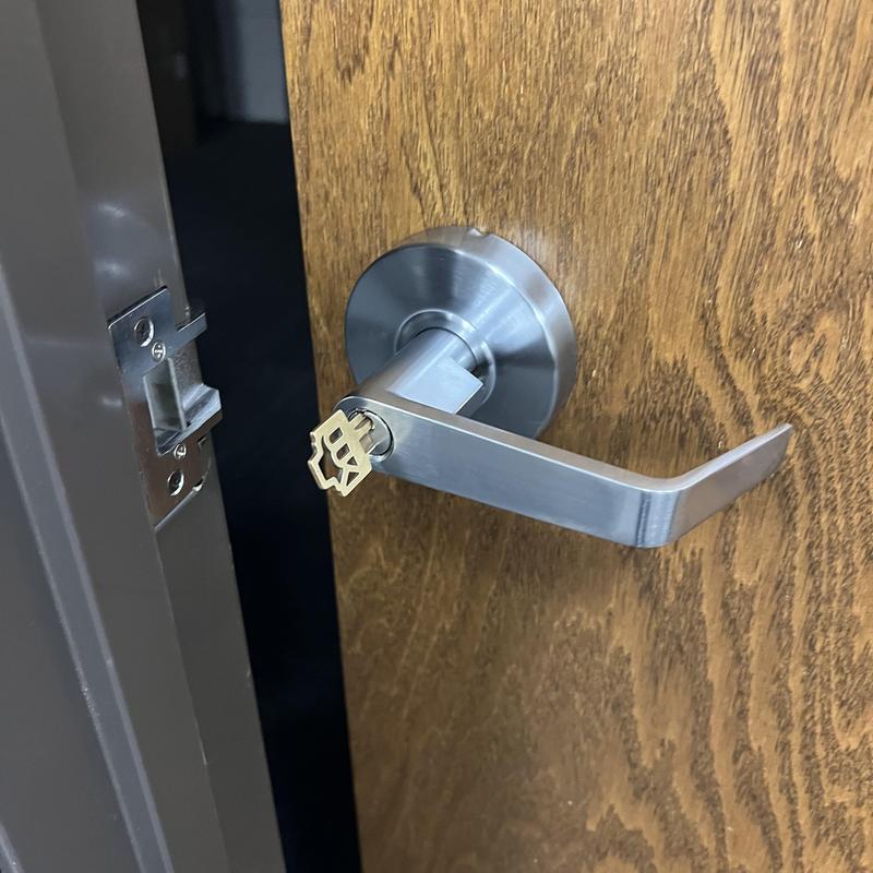 Entry door lever with matched key inserted Entry door lever with matched key inserted