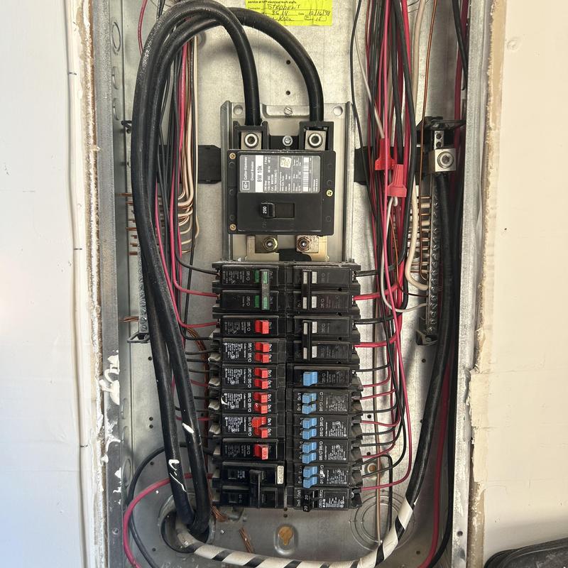 Electrical breaker panel with circuit breakers and wiring