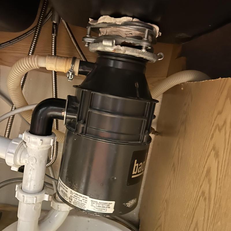 Garbage disposal unit installation under kitchen sink Garbage disposal unit installation under kitchen sink