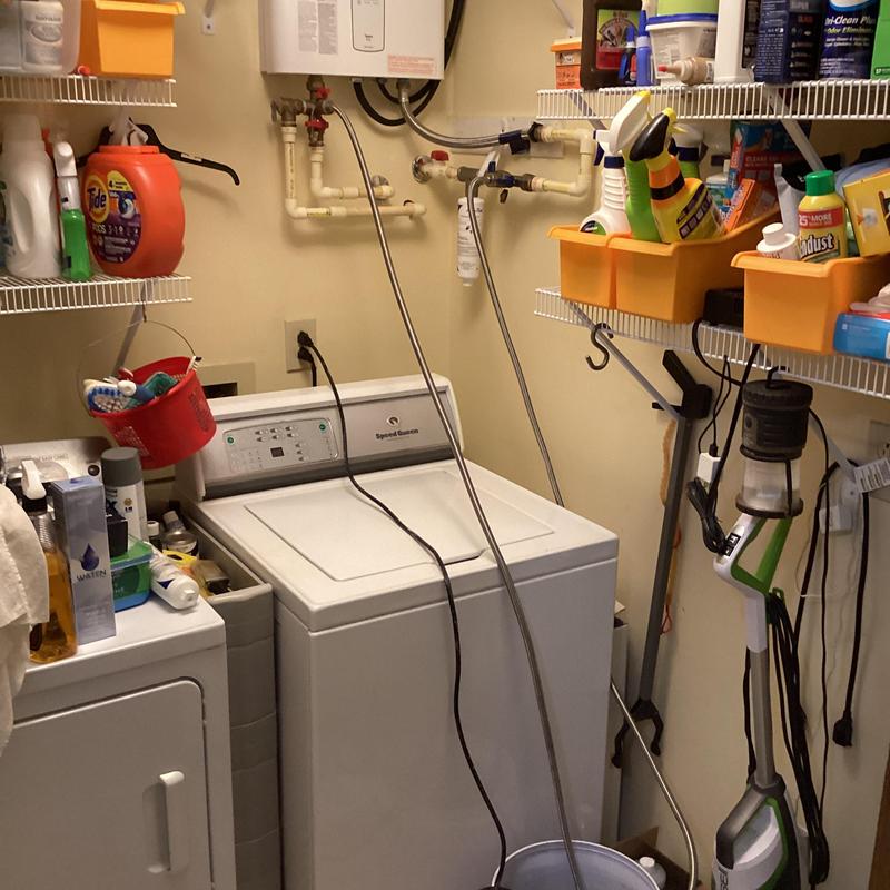 Water heater pipes and washing machine hookup in laundry room