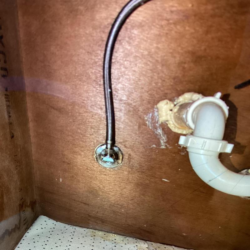 Supply line and PVC drain pipe inside vanity wall