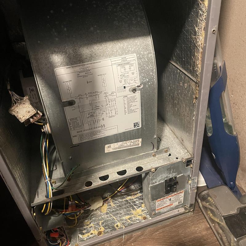 Air handler with removed door and exposed wiring Air handler with removed door and exposed wiring