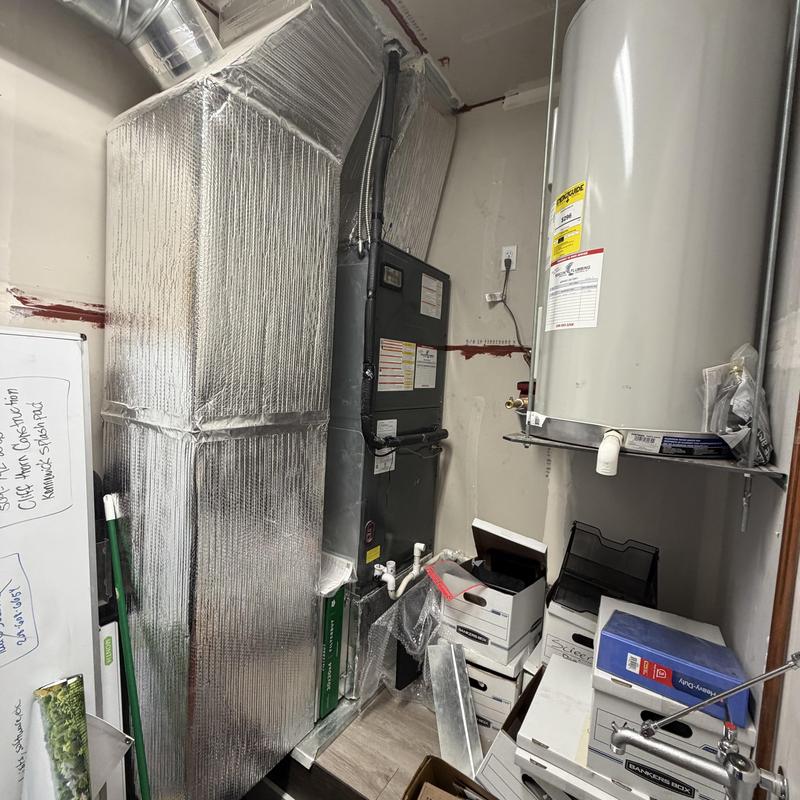 Heat pump air handler and furnace in utility room Heat pump air handler and furnace in utility room