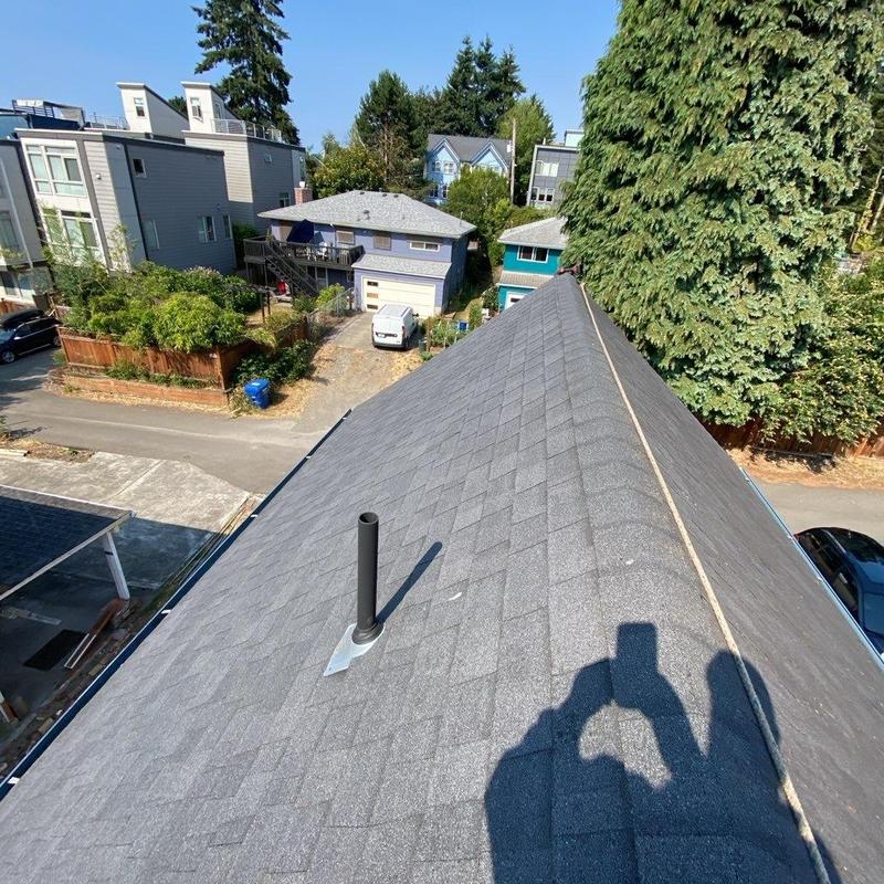 Asphalt shingle roof with vent pipe installation
