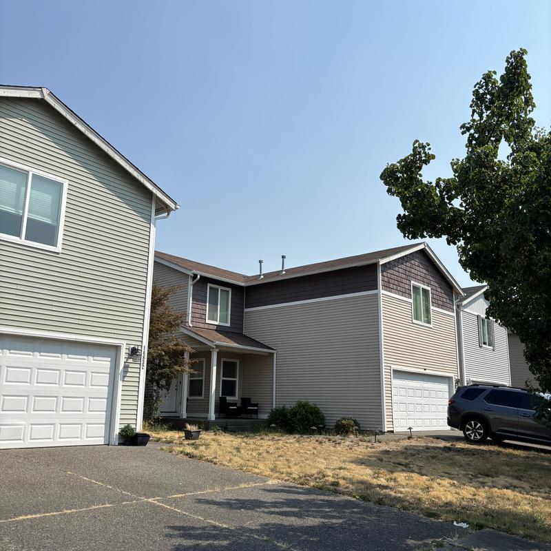 Roof shingles on two-story residential home in Hayden, ID Roof shingles on two-story residential home in Hayden, ID