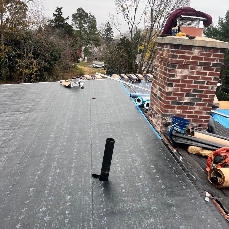 Flat roof underlayment installation near chimney Flat roof underlayment installation near chimney