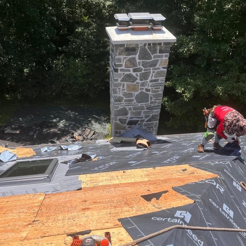Roof underlayment installation near stone chimney Roof underlayment installation near stone chimney