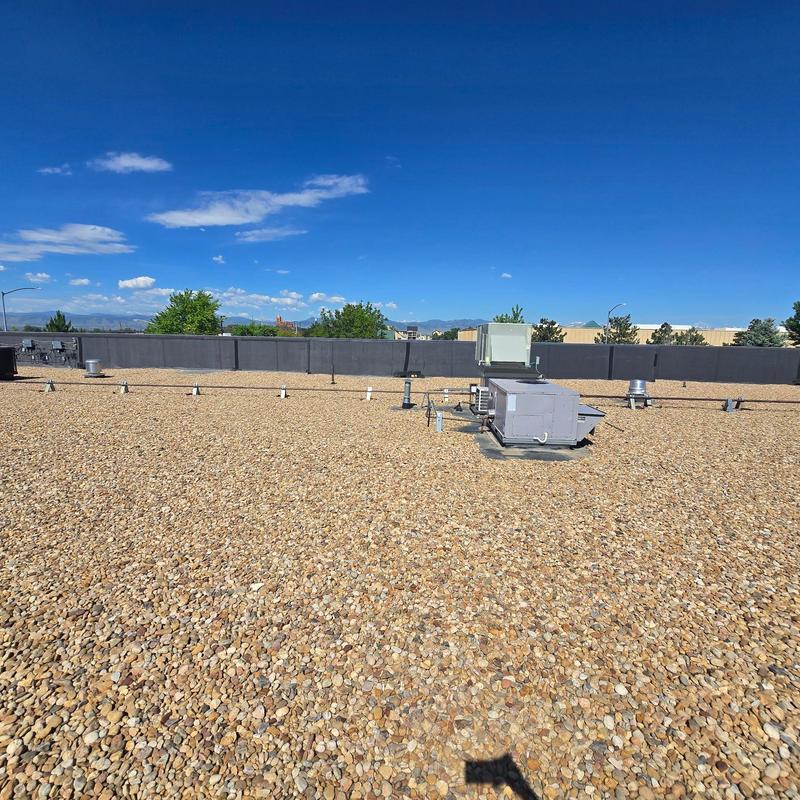 EPDM ballast flat roof with HVAC units and pipe jacks