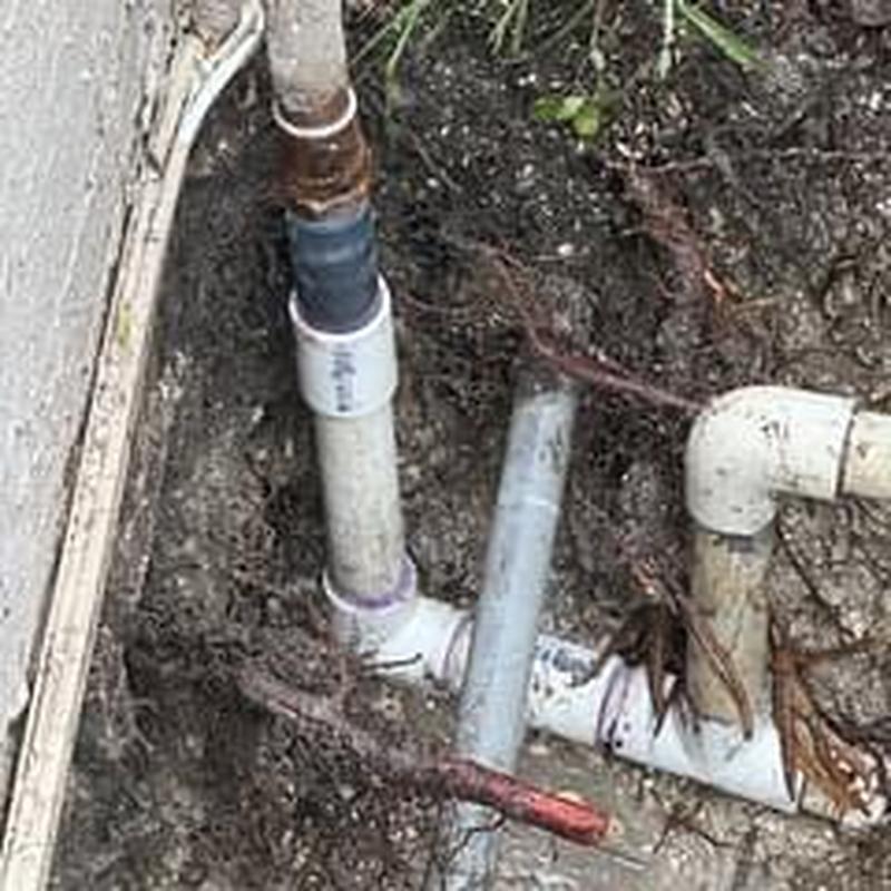 Main water service PVC pipe repair in soil trench