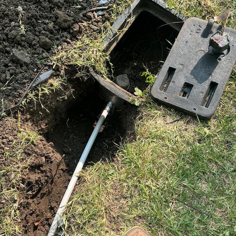 Pex water service line with meter box in yard trench