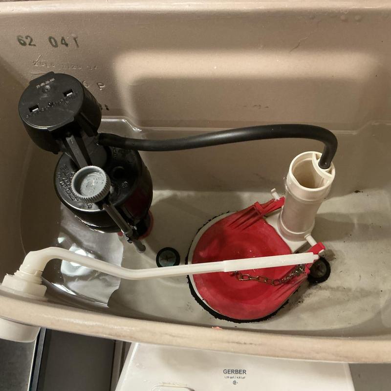 Toilet fill valve and flapper inside tank