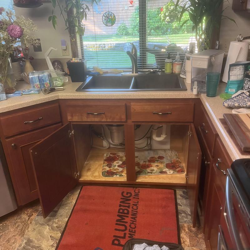 Kitchen sink faucet with open cabinet doors Kitchen sink faucet with open cabinet doors
