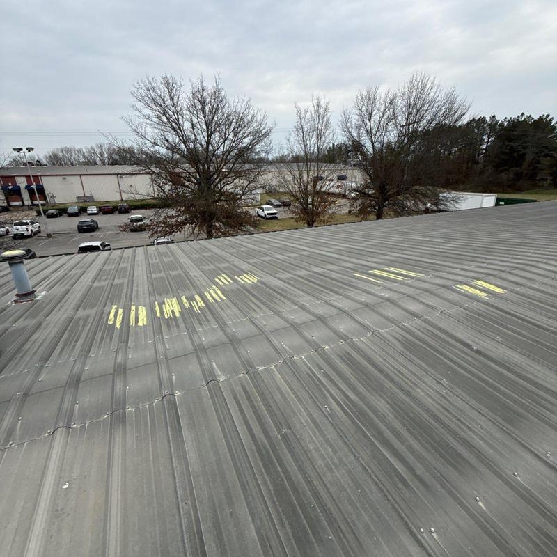 Metal roof panels with hail damage markings
