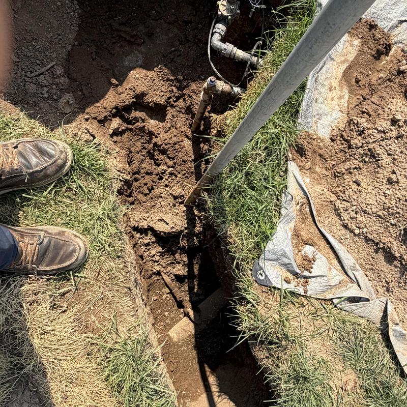Yard hydrant water connection and exposed pipe trench Yard hydrant water connection and exposed pipe trench