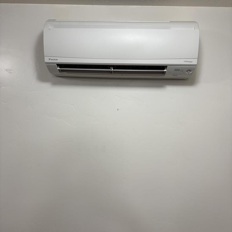 Indoor mini-split air conditioner mounted on wall Indoor mini-split air conditioner mounted on wall