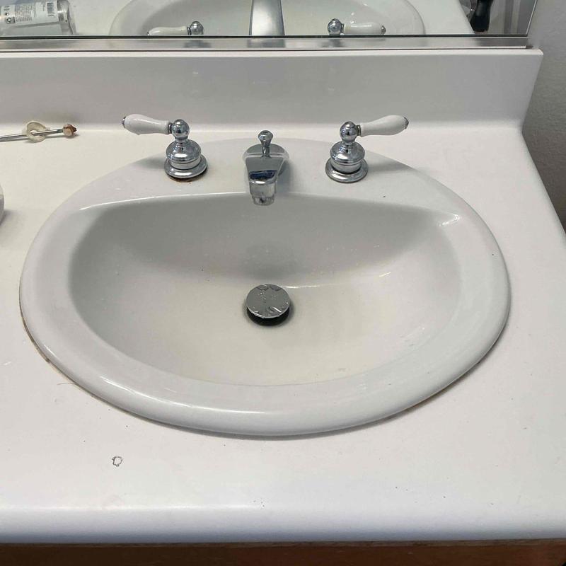 Bathroom sink pop-up drain assembly and faucet