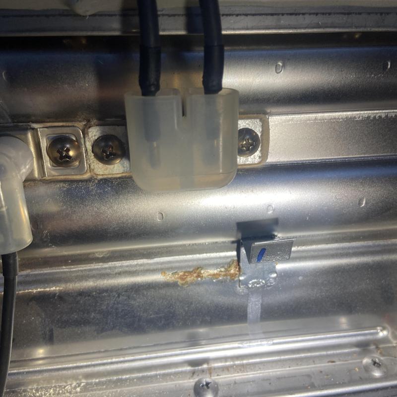 Water heater heating element wiring and mounting bracket close-up Water heater heating element wiring and mounting bracket close-up