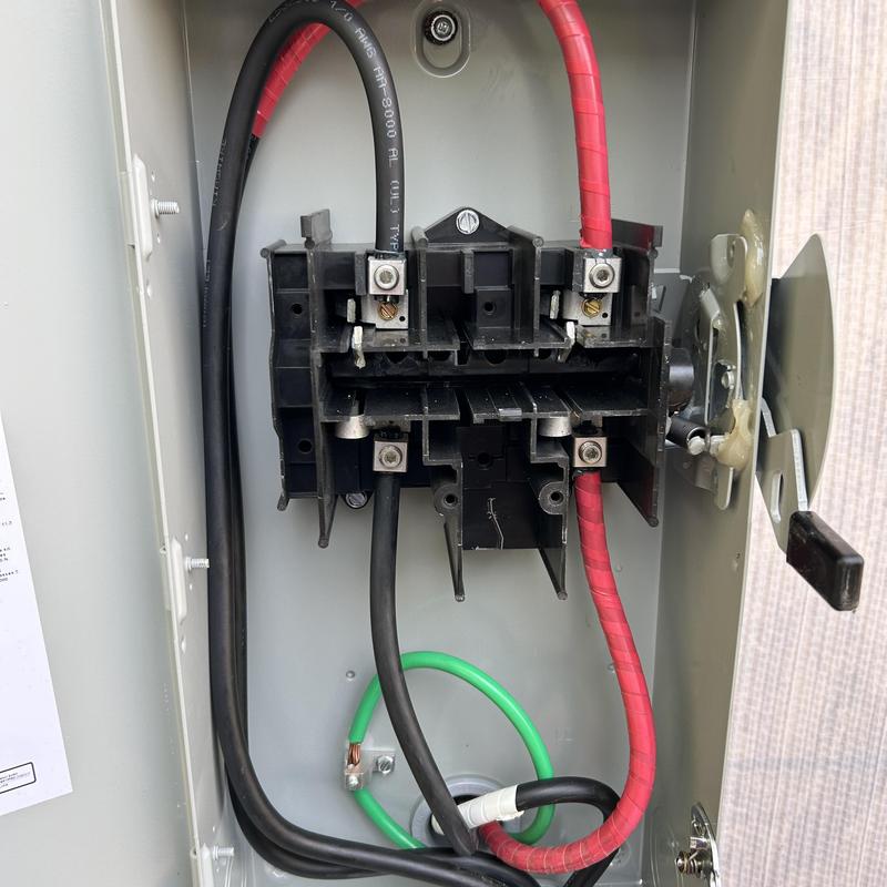 Electrical panel wiring with red and black cables