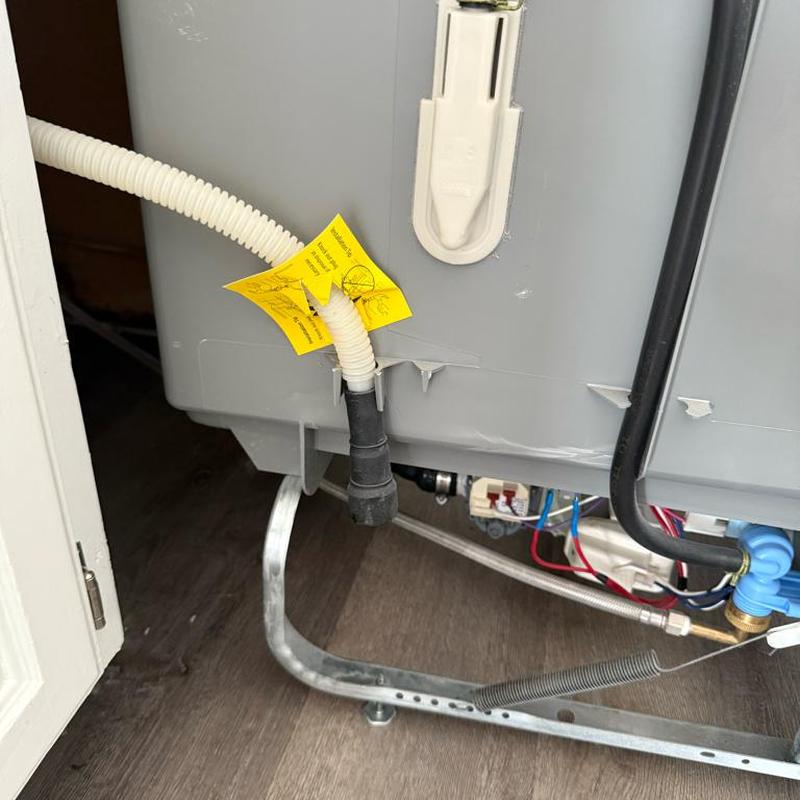 Dishwasher drain hose reconnected with clamp installed Dishwasher drain hose reconnected with clamp installed