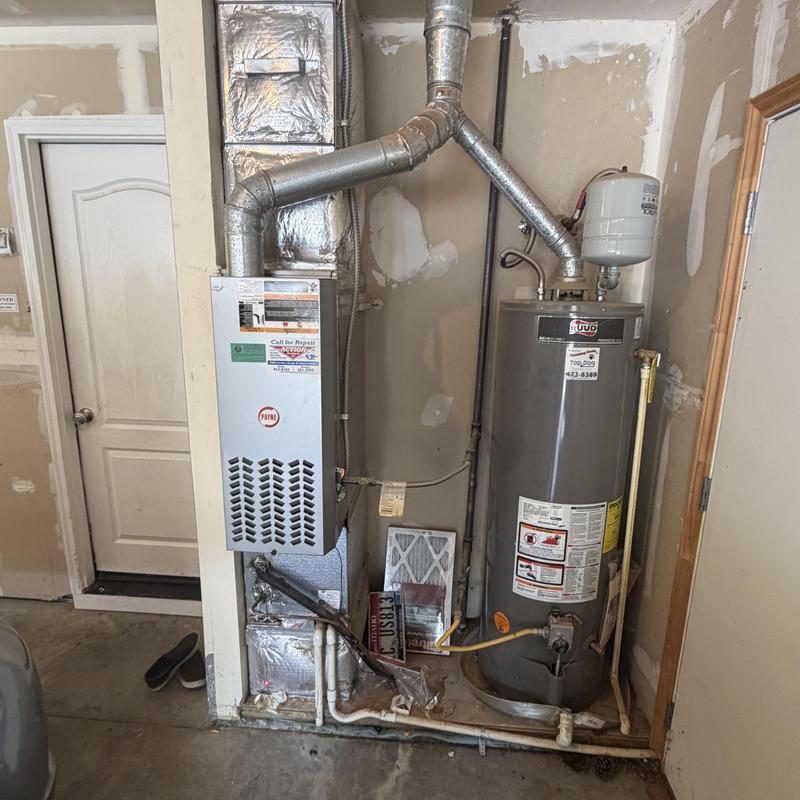 Furnace and water heater installation area in garage Furnace and water heater installation area in garage