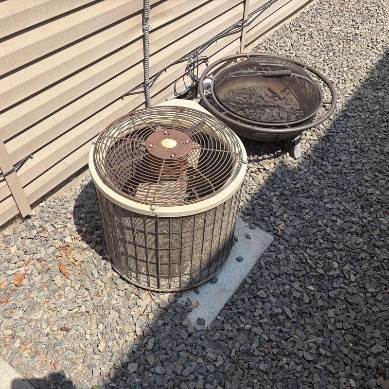 Outdoor air conditioning unit by house siding Outdoor air conditioning unit by house siding