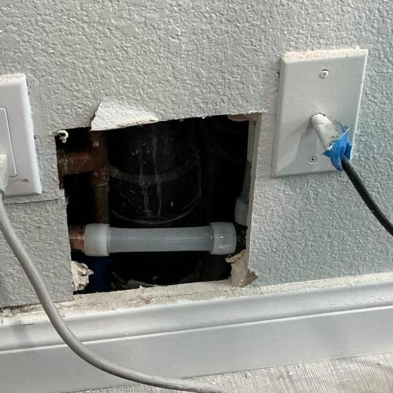 PEX water line rerouted through drywall opening