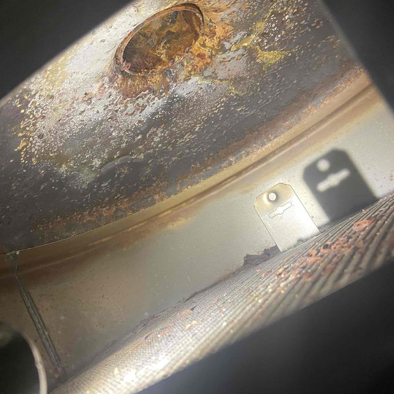 Water heater interior rust and corrosion buildup close-up Water heater interior rust and corrosion buildup close-up