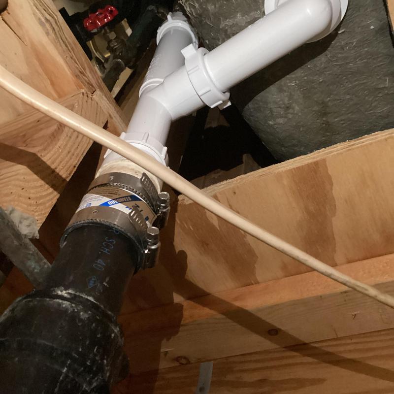 Tub overflow drain pipe connection with clamps
