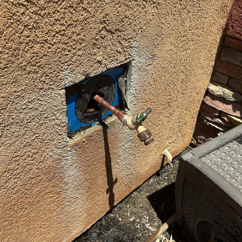 Copper hose bib piping modification at stucco wall