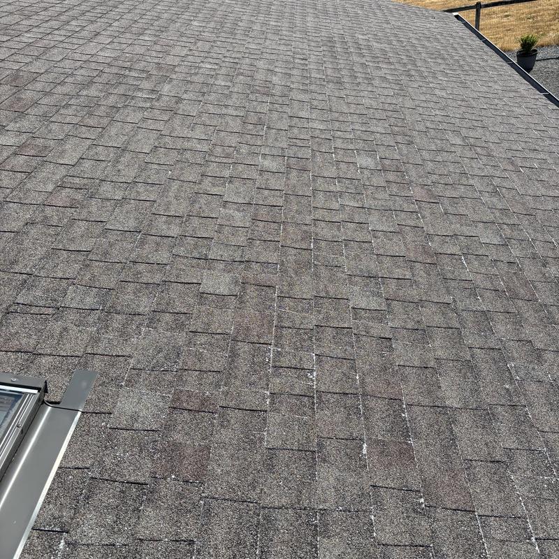 Asphalt shingle roof with visible wear in Hayden, ID Asphalt shingle roof with visible wear in Hayden, ID
